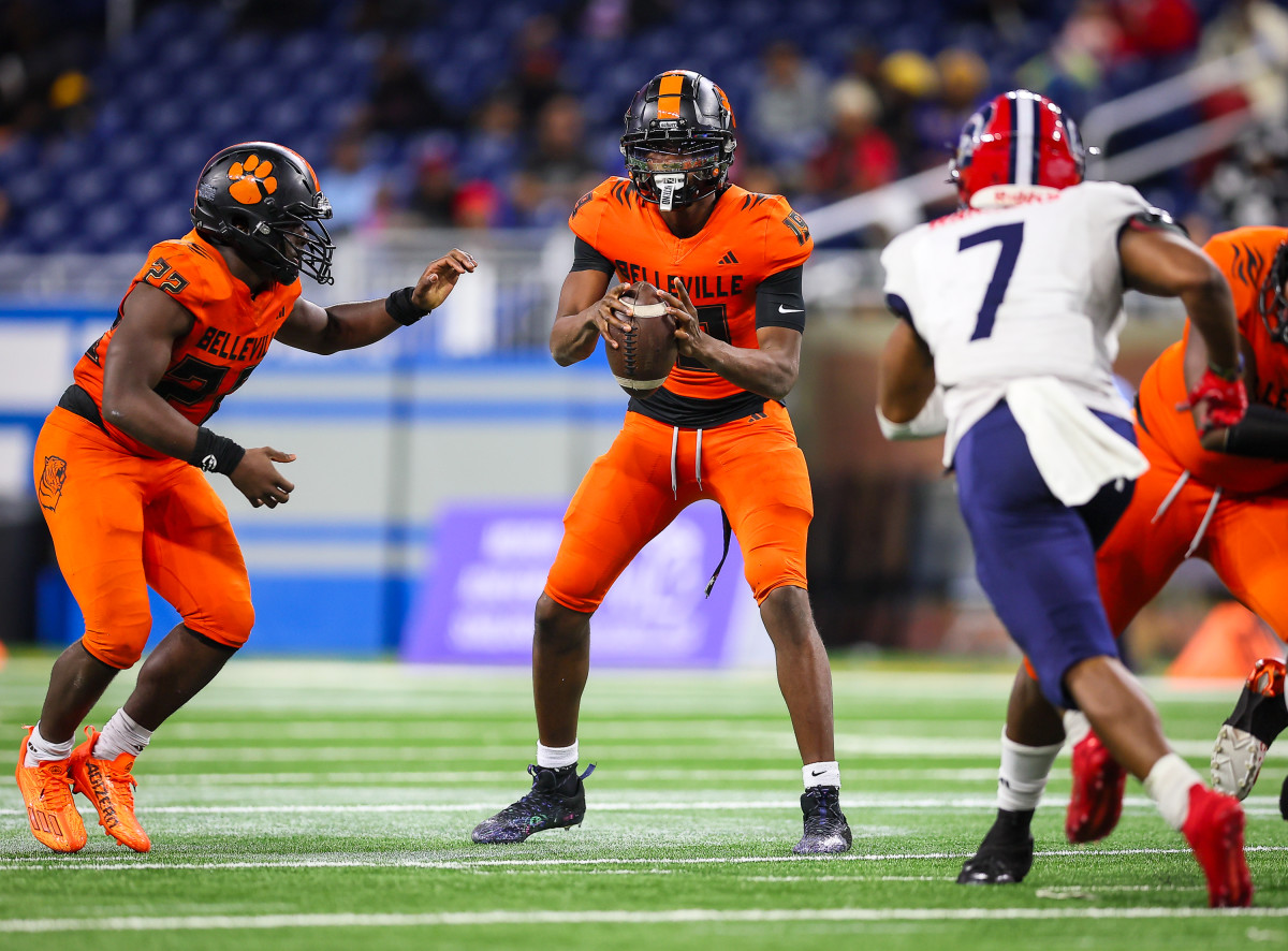 Underwood drops back for a pass in the MHSAA Division 1 title game against Southfield A&T. Photo by Mariusz Nowak.